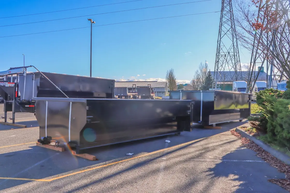 Roll-off dumpster ready for waste disposal at job site for Concrete Dumpster Rental in Seguin